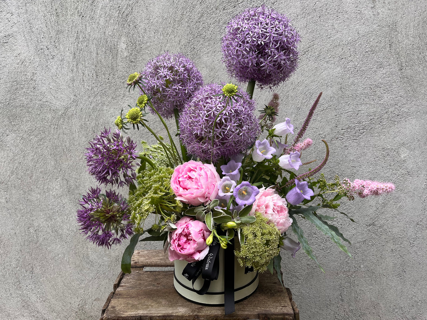Floral hat box arrangement with alliums, peonies, and wildflowers in a luxurious, garden-inspired style, handcrafted in Lusk, Ireland.